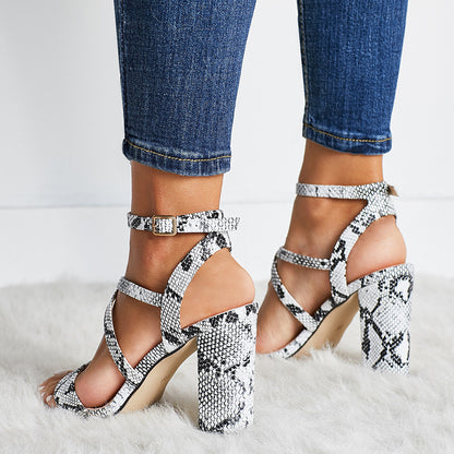 Snake-cut hollow high heel sandals